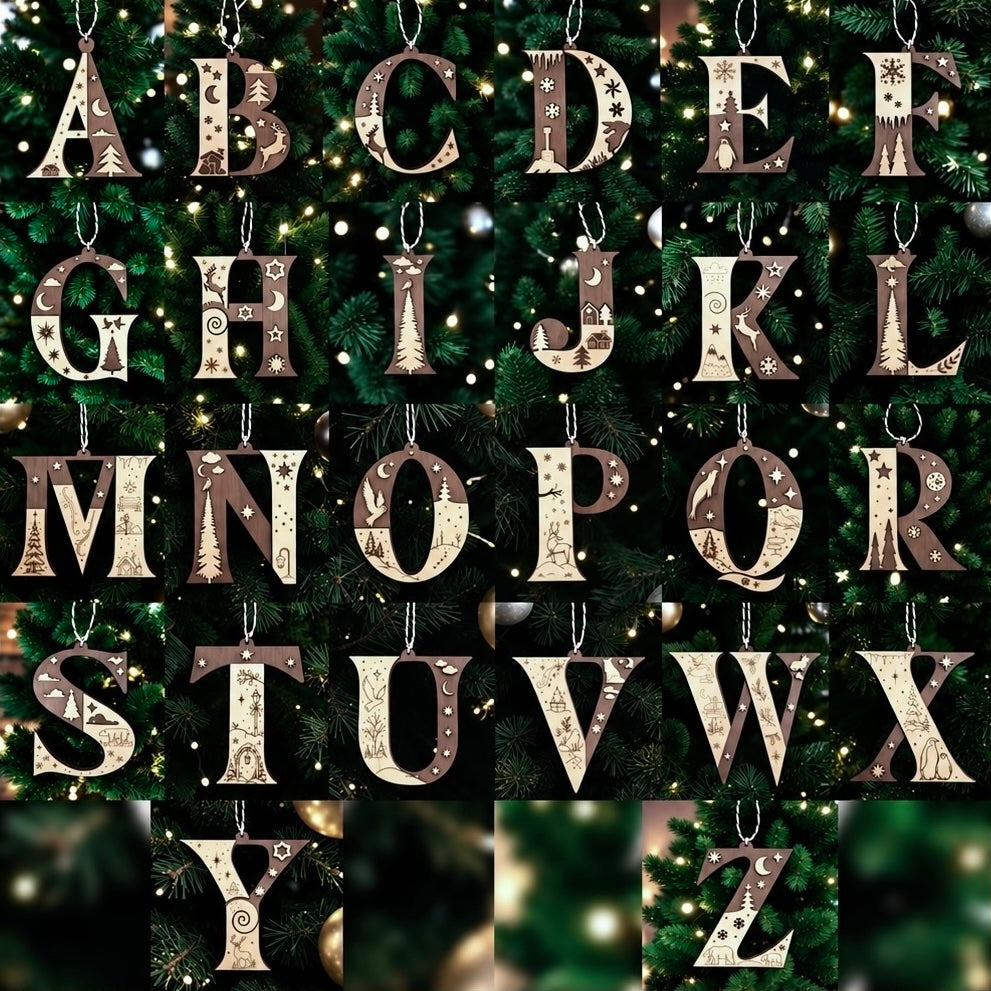 A set of hanging alphabet ornaments spelling out the letters A through Z, decorated with intricate patterns and hanging from silver hooks against a dark green Christmas tree background with warm lights.